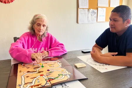 Lady Solving A Puzzle
